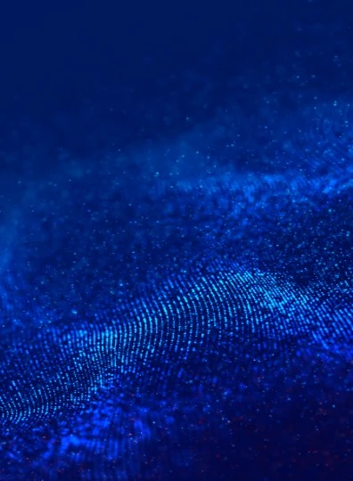 Abstrakcyjna niebieska grafika falujących punktów symbolizująca nowoczesne technologie i cyfrowe innowacje