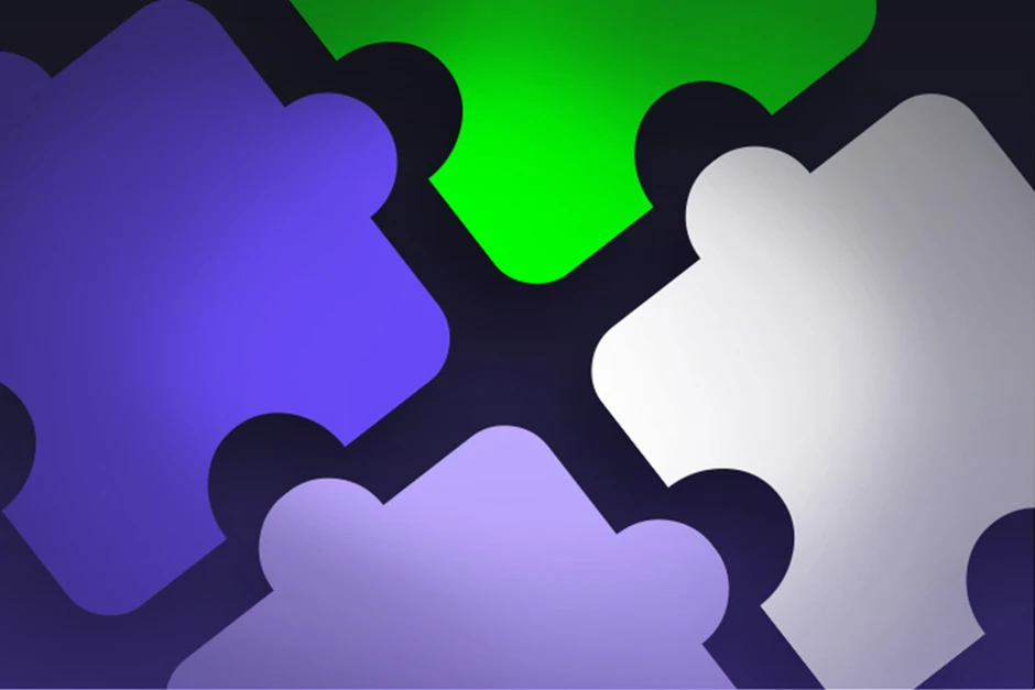 Kolorowe elementy układanki w odcieniach fioletu, zieleni i szarości symbolizujące współpracę w firmie